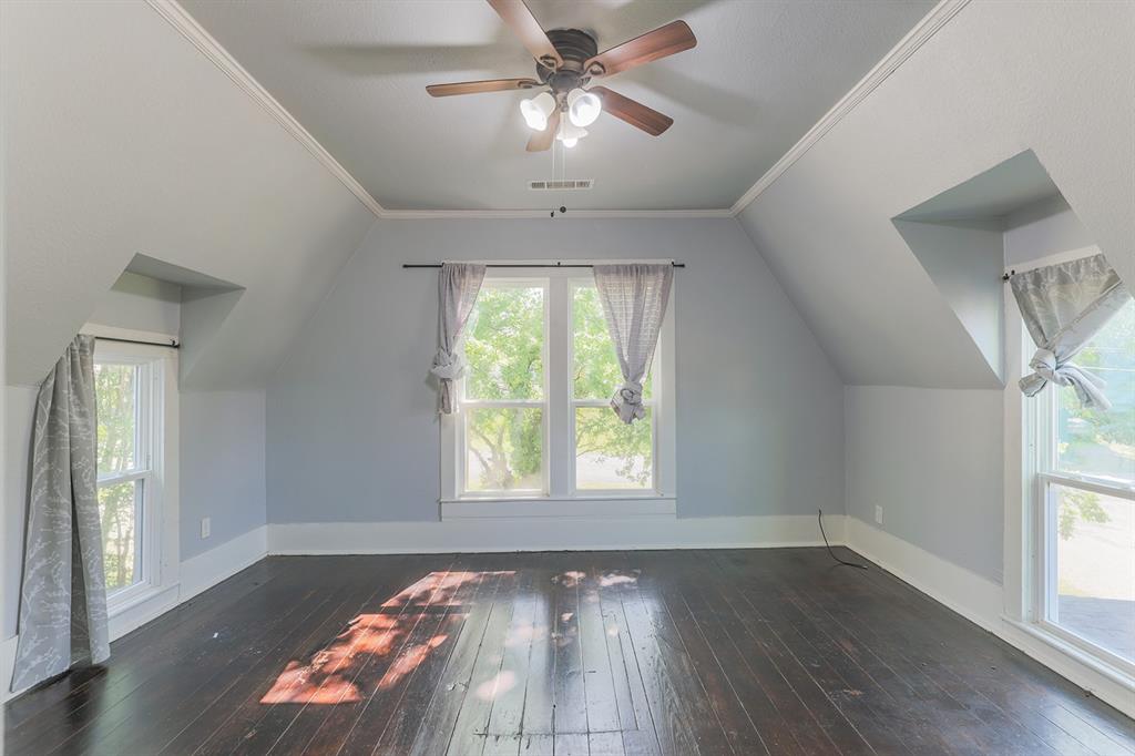 453 East Marshall Street Van Alstyne, TX 75495 - Photo 24 of 30 a view of an empty room with wooden floor and a window
