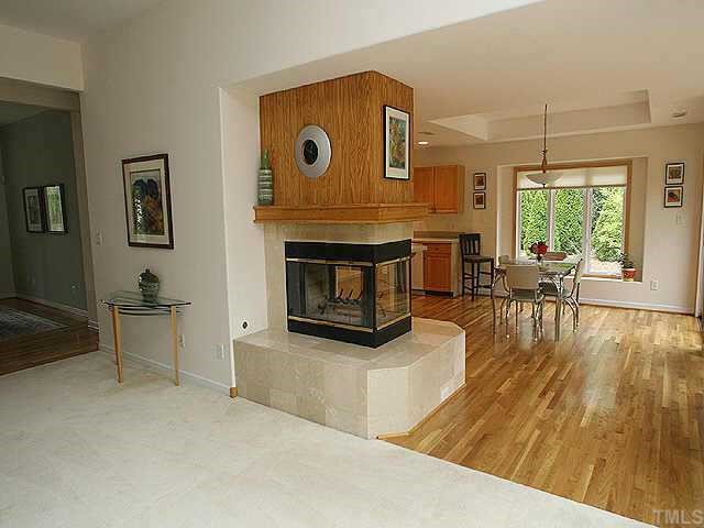 5312 Mandrake Court Raleigh, NC 27613 - Photo 5 of 8 a living room with furniture and a fireplace