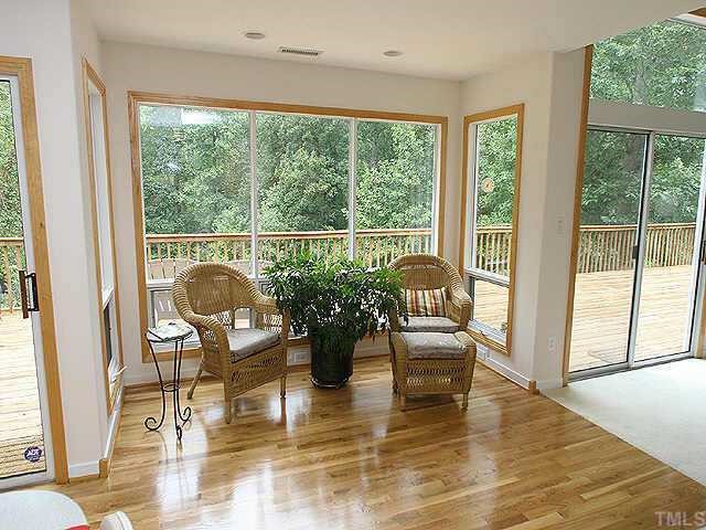 5312 Mandrake Court Raleigh, NC 27613 - Photo 8 of 8 a living room with fireplace furniture and a large window