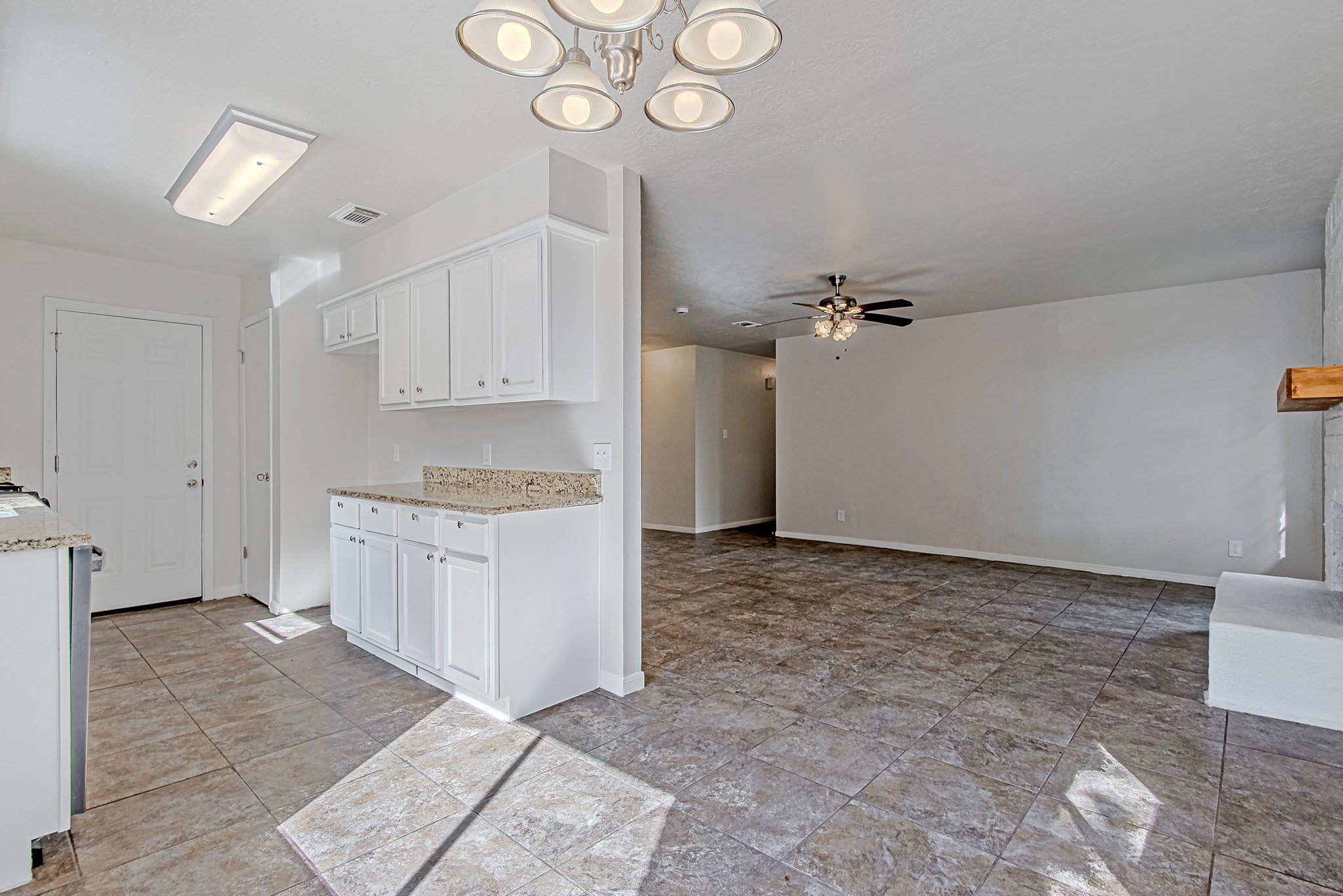 24306 Spring Mill Lane Spring, TX 77373 - Photo 24 of 24 a big room with chandelier fan and kitchen view