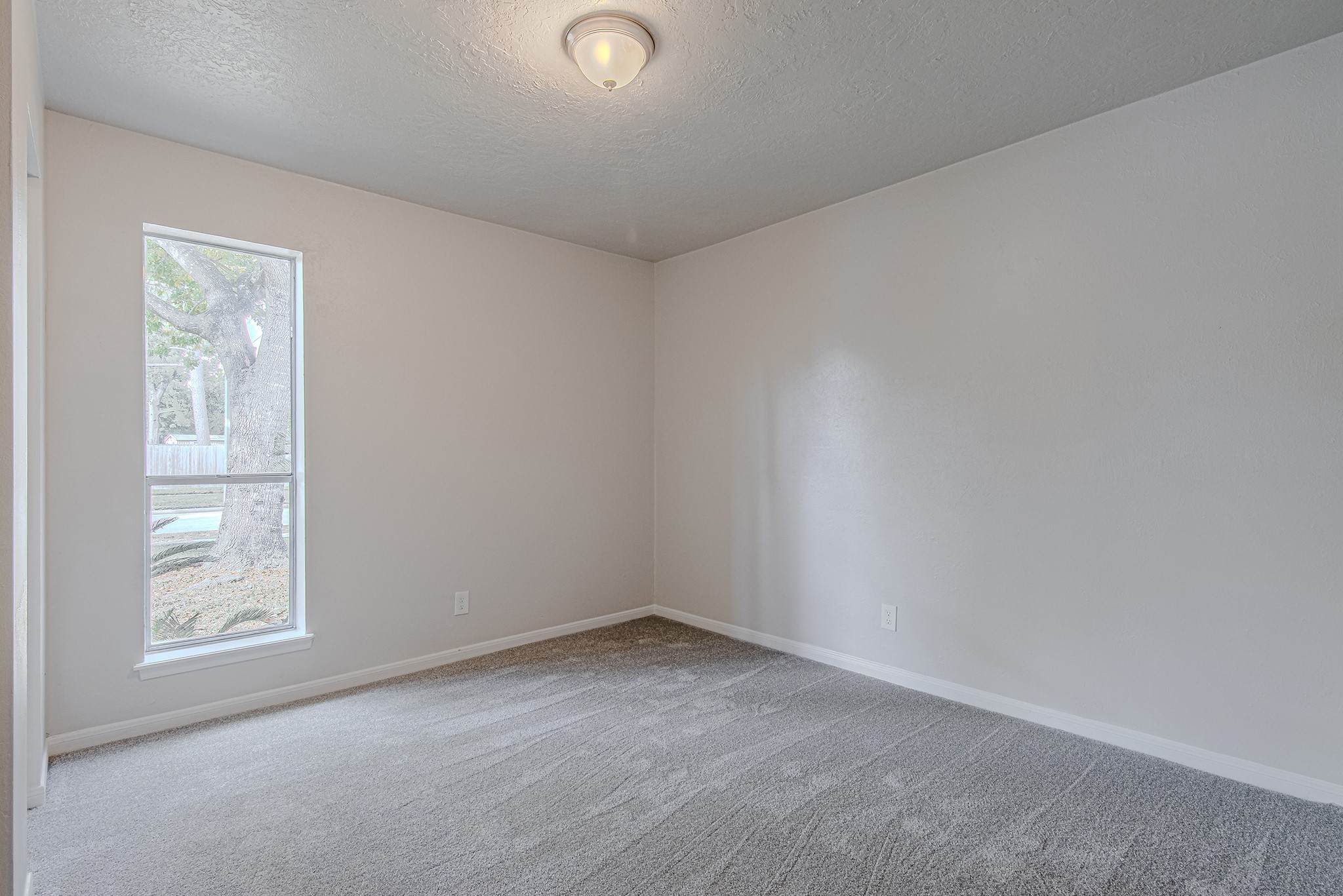 24306 Spring Mill Lane Spring, TX 77373 - Photo 18 of 24 an empty room with windows