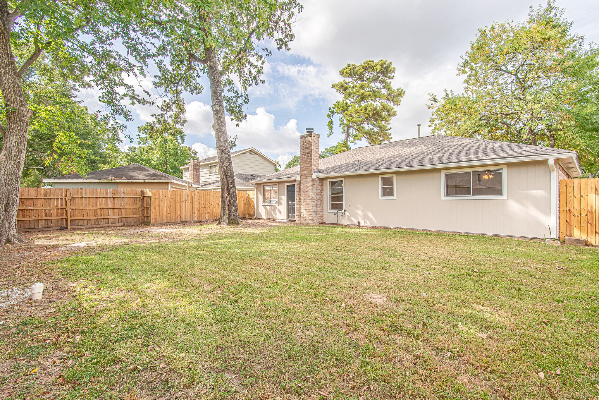24306 Spring Mill Lane Spring, TX 77373 - Photo 21 of 24 a front view of a house with a garden