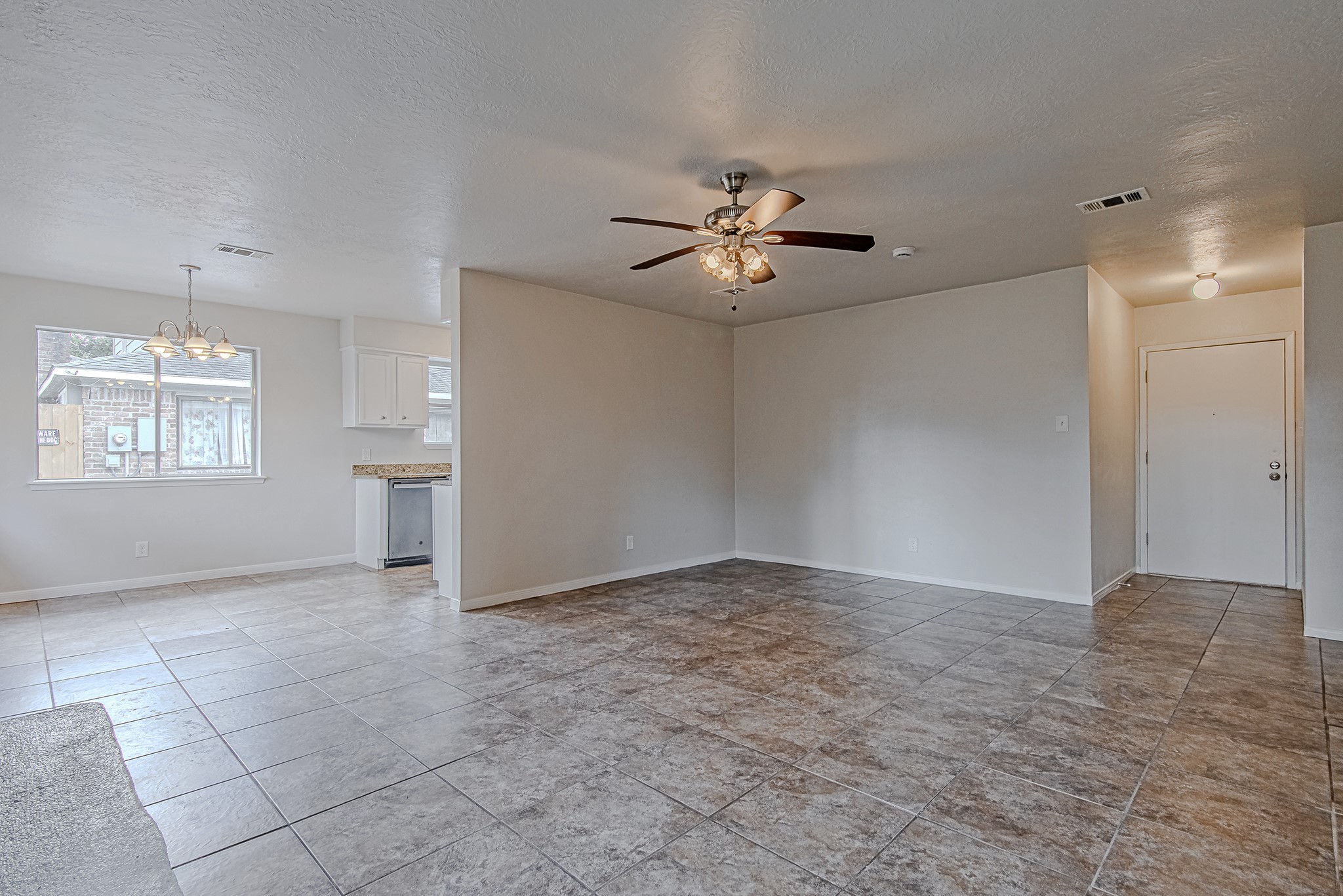 24306 Spring Mill Lane Spring, TX 77373 - Photo 7 of 24 an empty room with windows and ceiling fan