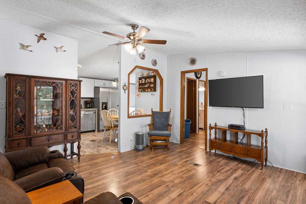 39 Red Bush School Road Blue Ridge, GA 30513 - Photo 25 of 36 a living room with furniture and a flat screen tv