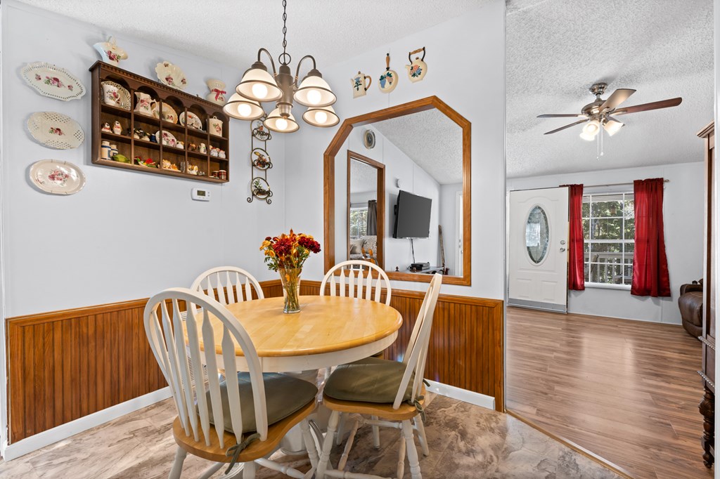 39 Red Bush School Road Blue Ridge, GA 30513 - Photo 26 of 36 a view of a dining room with furniture and wooden floor