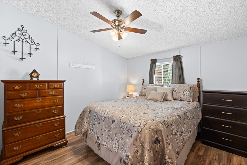 39 Red Bush School Road Blue Ridge, GA 30513 - Photo 28 of 36 a bedroom with a bed and a dresser