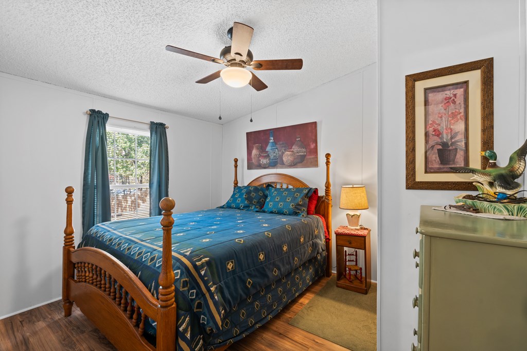 39 Red Bush School Road Blue Ridge, GA 30513 - Photo 32 of 36 a bedroom with two beds and paintings on the wall