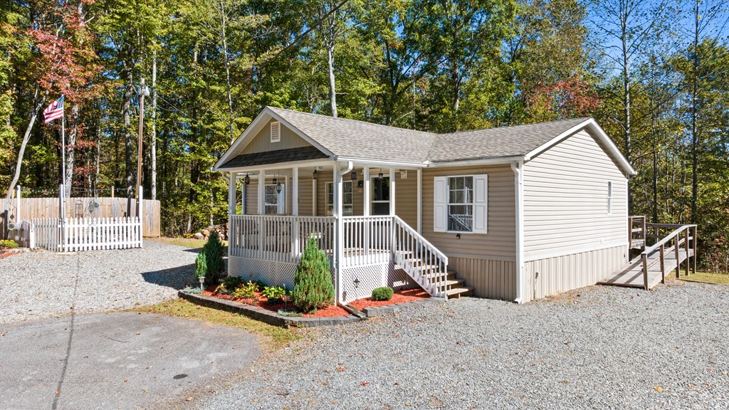 39 Red Bush School Road Blue Ridge, GA 30513 - Photo 7 of 36 a house view with a garden space