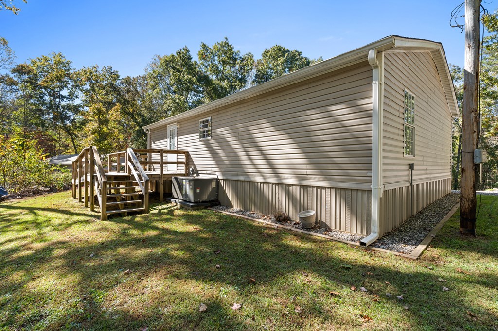 39 Red Bush School Road Blue Ridge, GA 30513 - Photo 10 of 36 a view of a house with a yard and a wooden fence