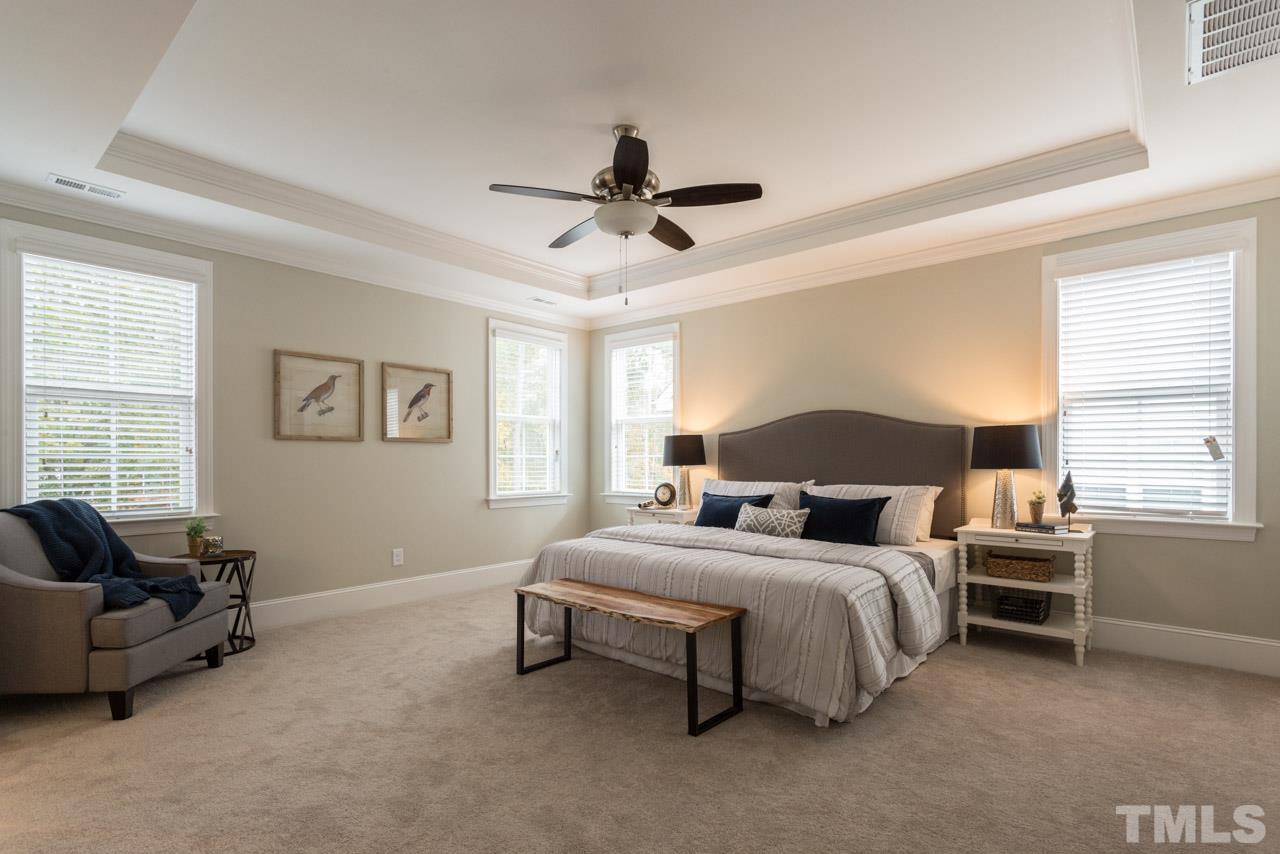 4612 Pleasant Pointe Way Raleigh, NC 27613 - Photo 16 of 25 a bedroom with a bed couch and a window