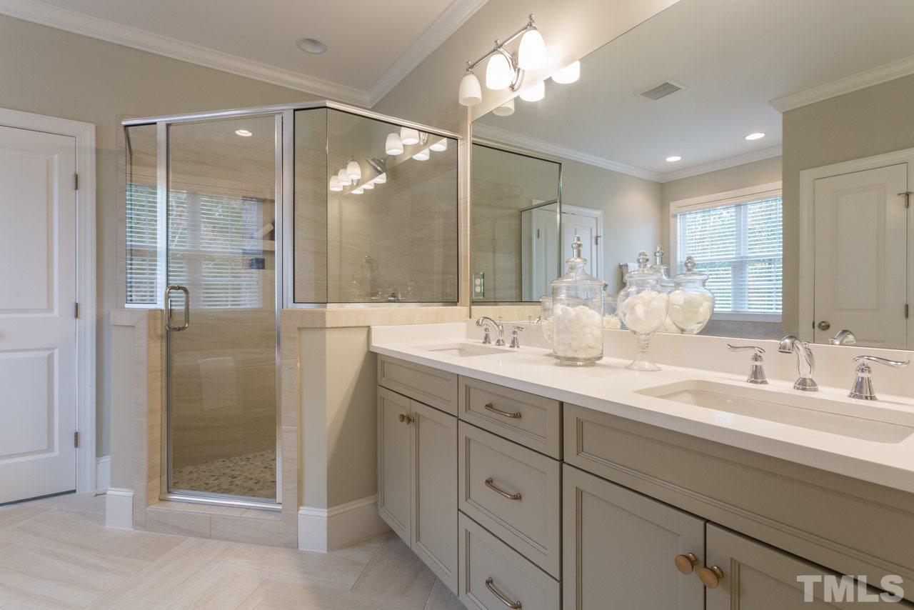 4612 Pleasant Pointe Way Raleigh, NC 27613 - Photo 17 of 25 a bathroom with a double vanity sink mirror and shower