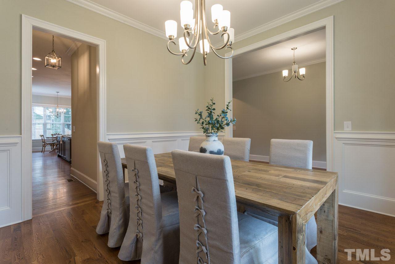 4612 Pleasant Pointe Way Raleigh, NC 27613 - Photo 4 of 25 a view of a dining room with furniture and wooden floor