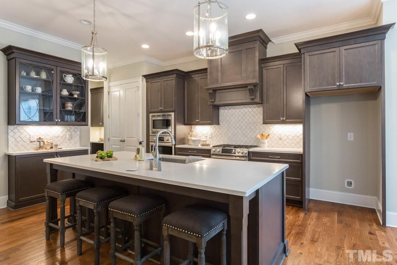 4612 Pleasant Pointe Way Raleigh, NC 27613 - Photo 5 of 25 a kitchen with granite countertop a sink stove and refrigerator