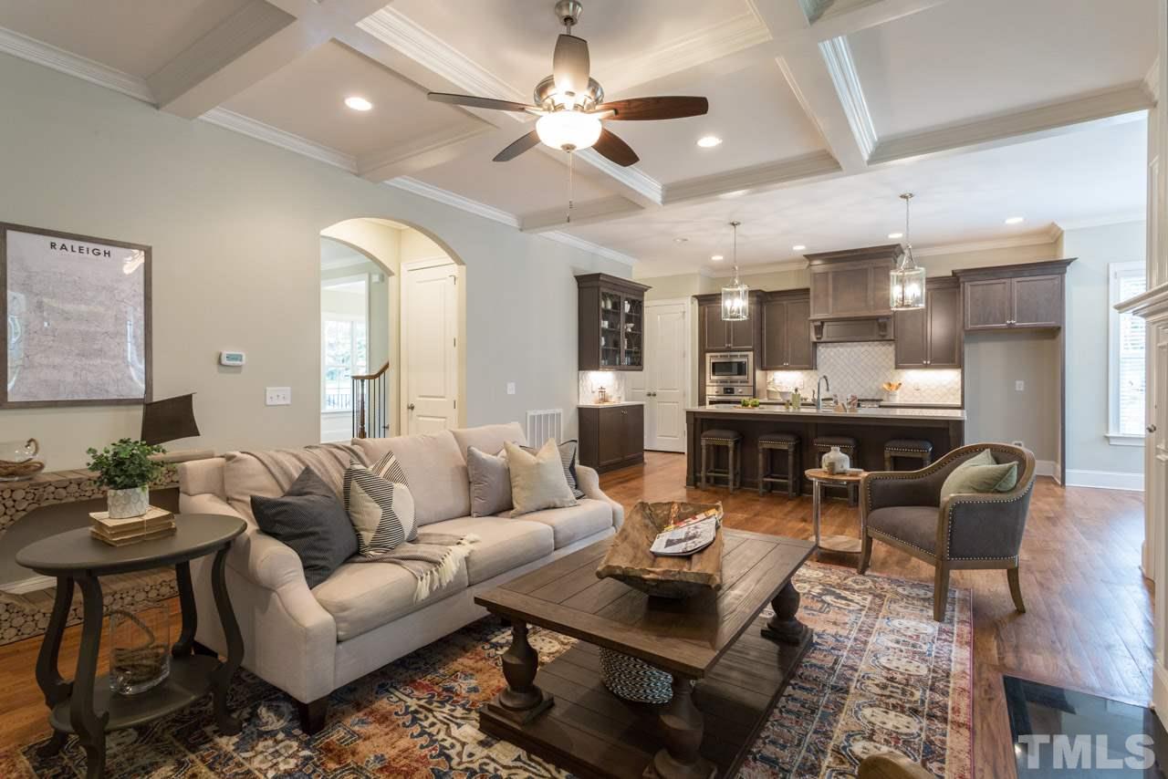 4612 Pleasant Pointe Way Raleigh, NC 27613 - Photo 9 of 25 a living room with furniture kitchen view and a chandelier