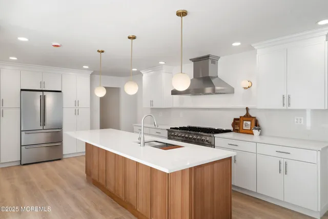 a view of a living room a stove and wooden floor