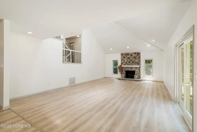 a kitchen with cabinets stainless steel appliances and a counter space