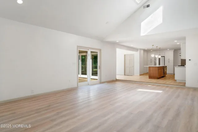 a bathroom with a sink toilet and window