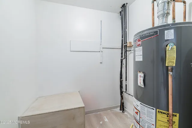 a view of a livingroom with furniture fireplace and workspace