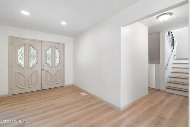 a bathroom with a sink and a window