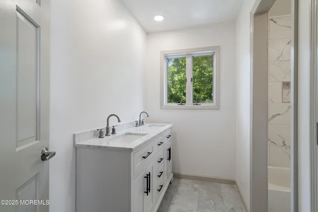 an aerial view of a house with a yard and outdoor seating