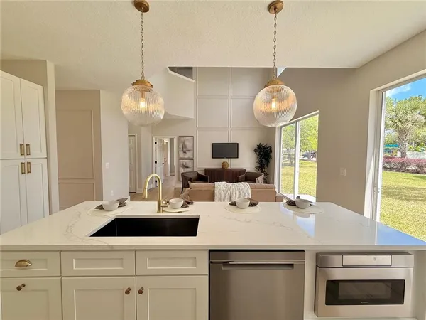 a bathroom with a double vanity sink mirror and toilet