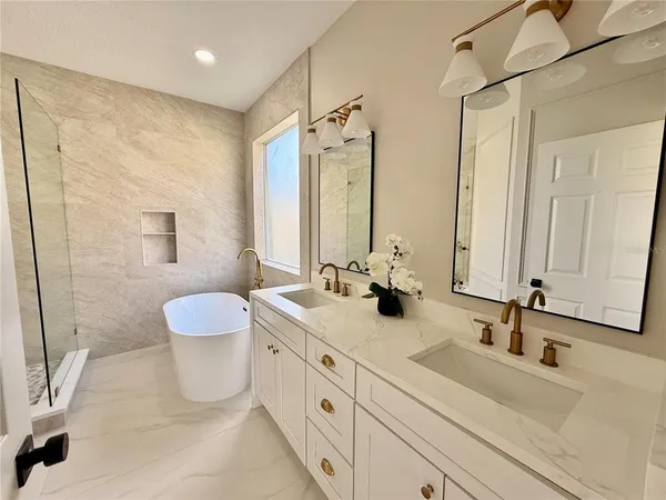 a view of a big room with wooden floor and windows