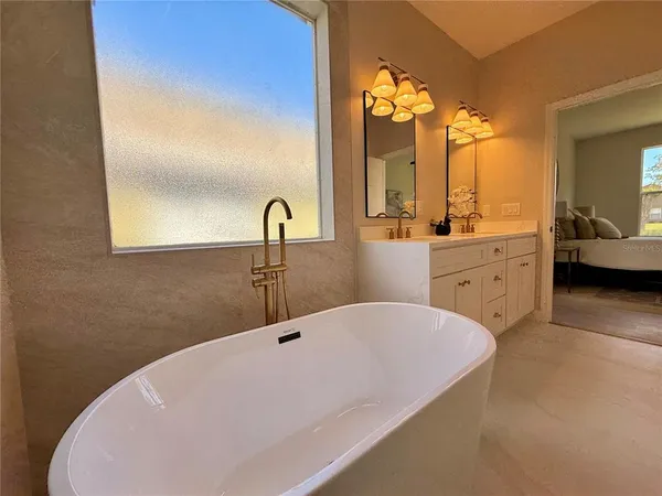 a bathroom with a sink toilet and mirror