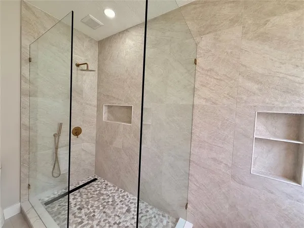 a bathroom with a sink vanity and a mirror