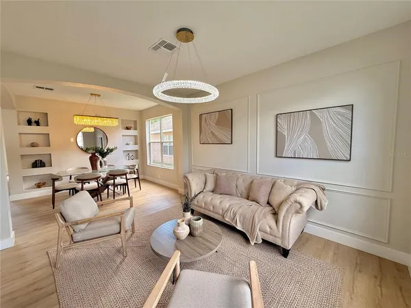 a view of a dining room with furniture window and wooden floor