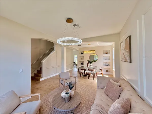 a kitchen with a table chairs stove and cabinets