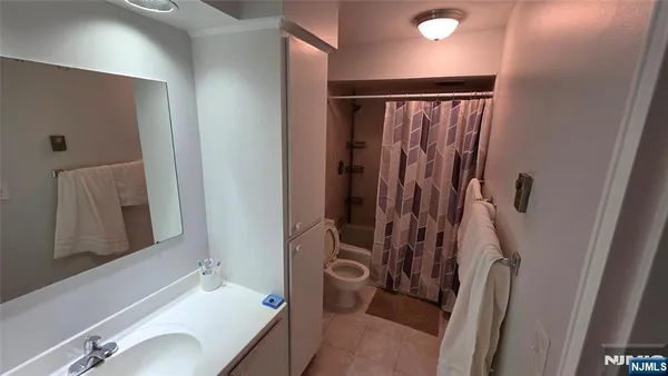 a bathroom with a tub and a shower