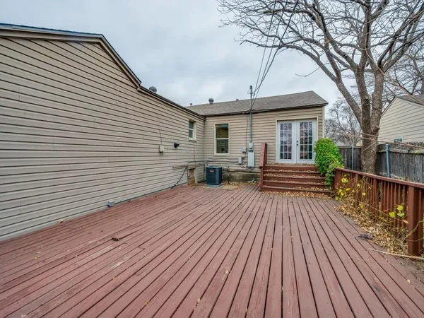 a view of a house with wooden deck