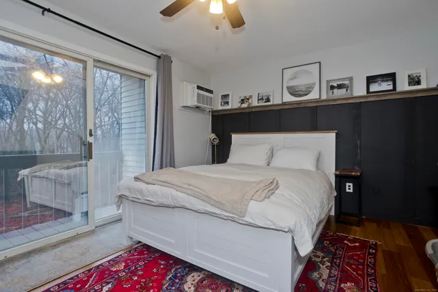 a bedroom with a bed and window