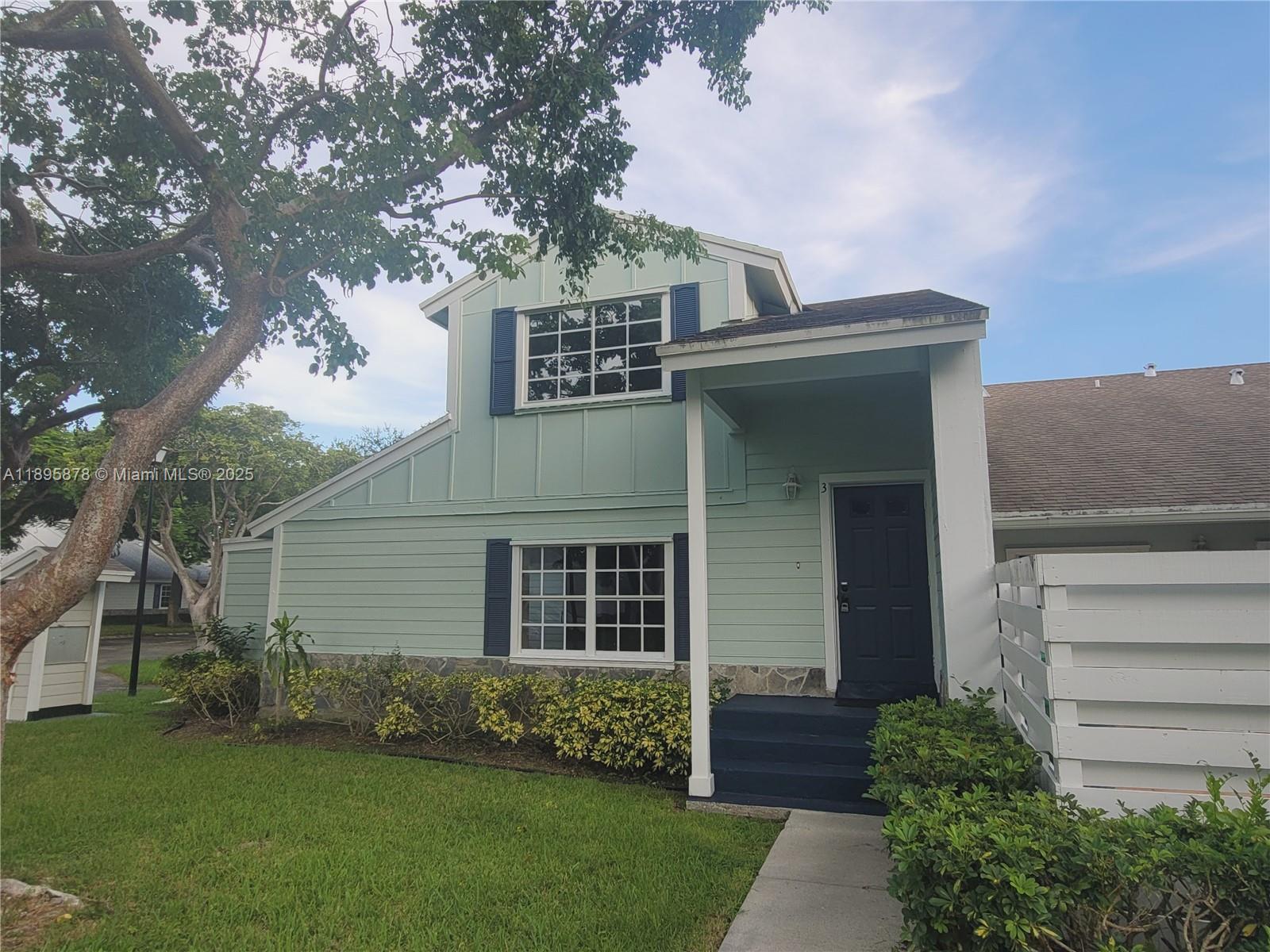13814 Southwest 149th Cir Lane, Unit 362 Miami, FL 33186 - Photo 1 of 19 a front view of a house with a garden