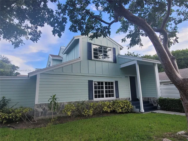 a view of backyard with sitting area