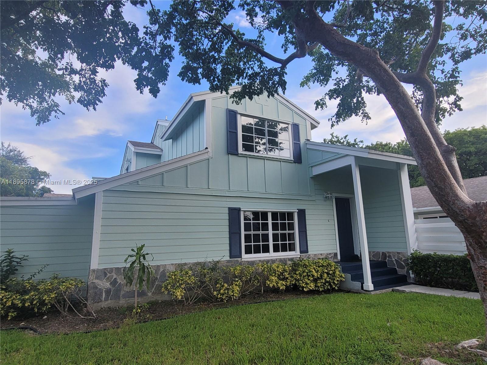 13814 Southwest 149th Cir Lane, Unit 362 Miami, FL 33186 - Photo 13 of 19 a view of a house with a garden