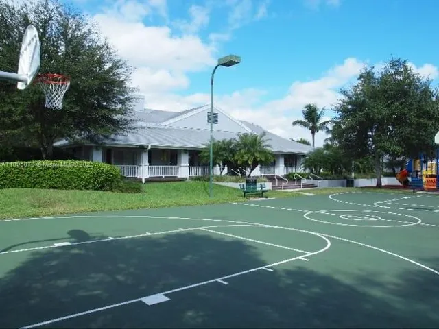 a view of a swimming pool with a patio