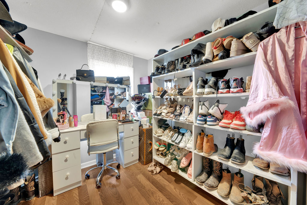 7245 West Dralle Road Monee, IL 60449 - Photo 36 of 73 a view of walk in closet with clothes and shoes