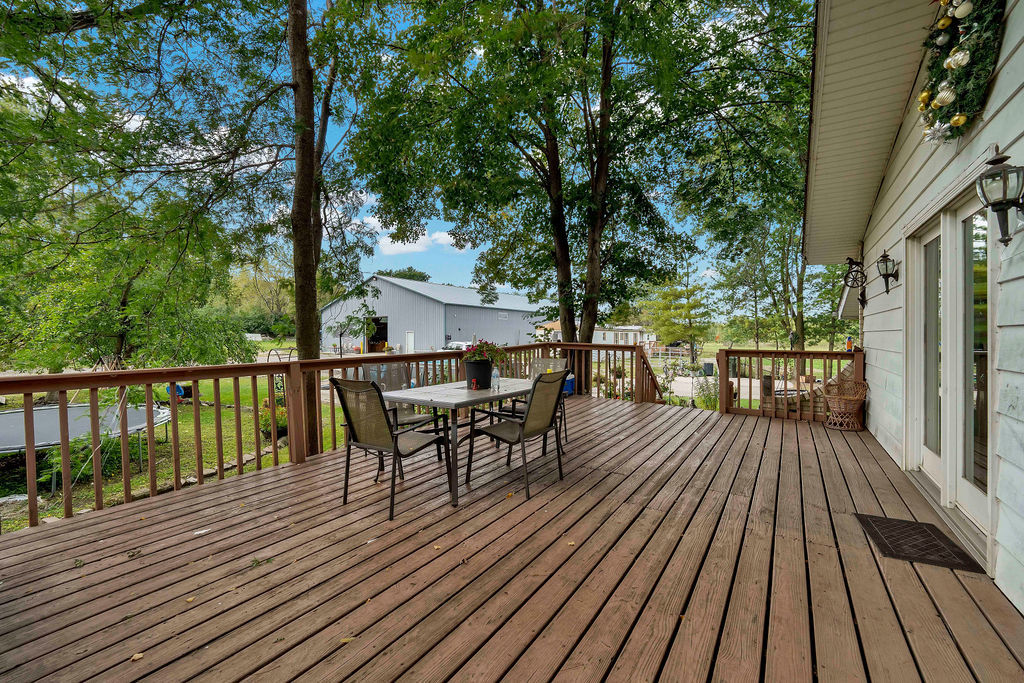 7245 West Dralle Road Monee, IL 60449 - Photo 43 of 73 a view of a balcony with two chairs and wooden floor