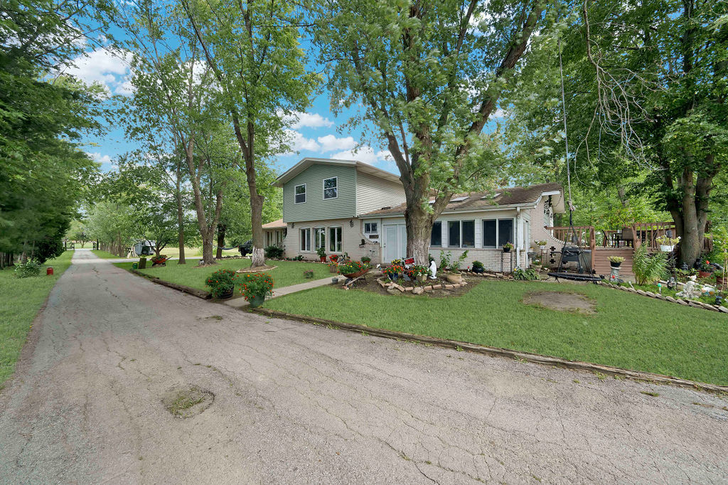 7245 West Dralle Road Monee, IL 60449 - Photo 59 of 73 a front view of a house with yard and green space