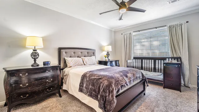 a bedroom with a bed and window