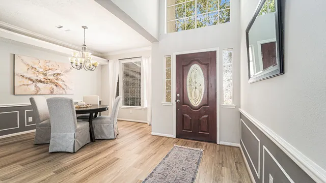 a view of a dining room with furniture window and wooden floor