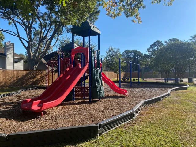 a view of a backyard with a sitting area