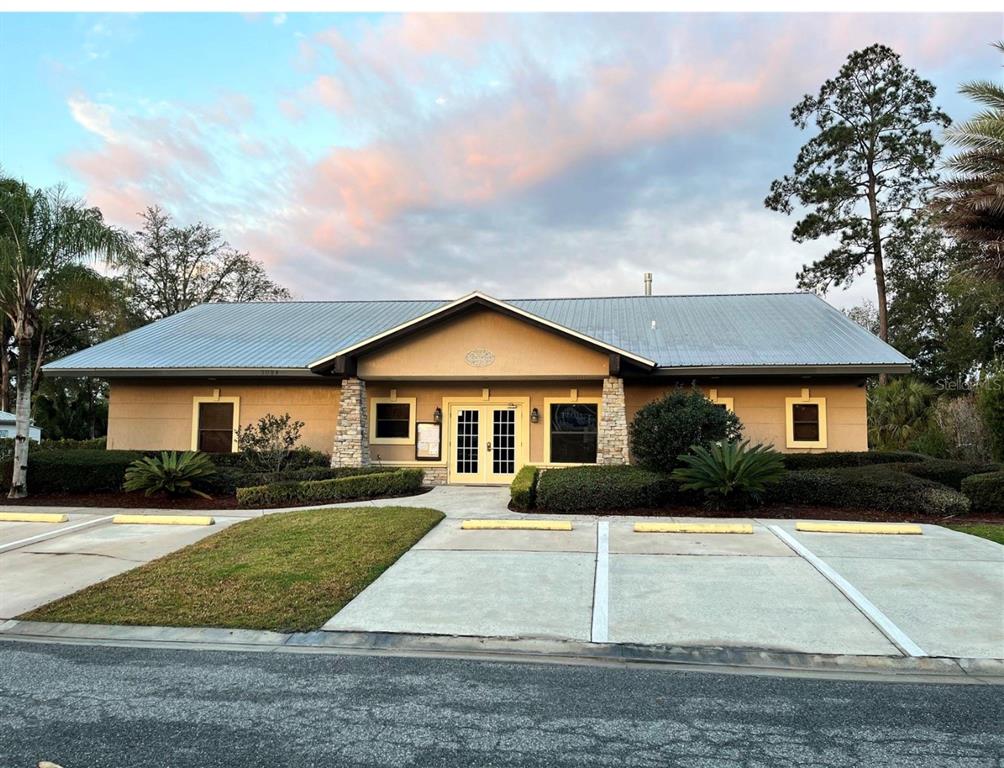 10264 Northeast 28th Loop Silver Springs, FL 34488 - Photo 14 of 44 a front view of house with yard and green space