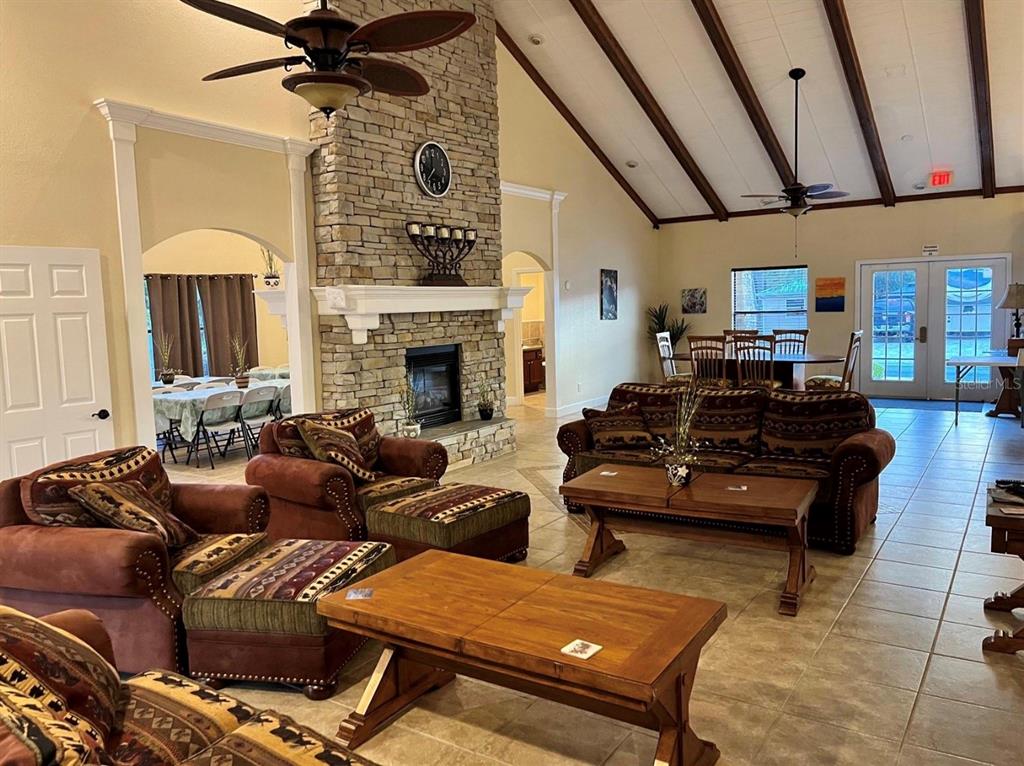 10264 Northeast 28th Loop Silver Springs, FL 34488 - Photo 16 of 44 a living room with furniture and a fireplace