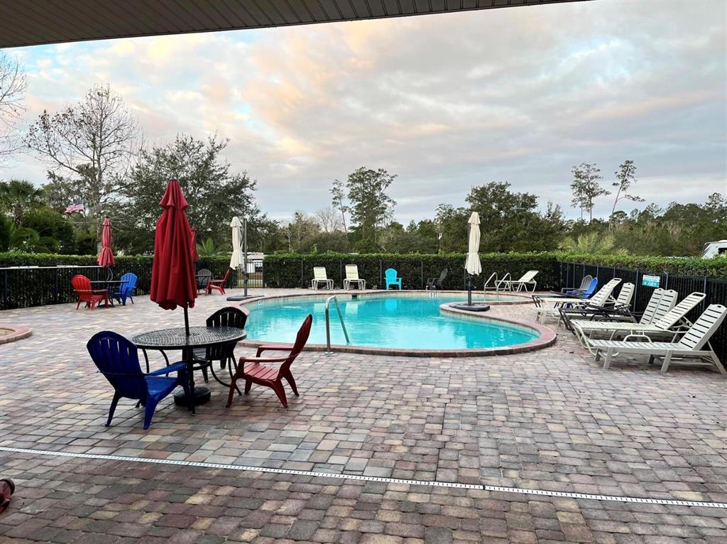 10264 Northeast 28th Loop Silver Springs, FL 34488 - Photo 20 of 44 a view of a backyard with sitting area