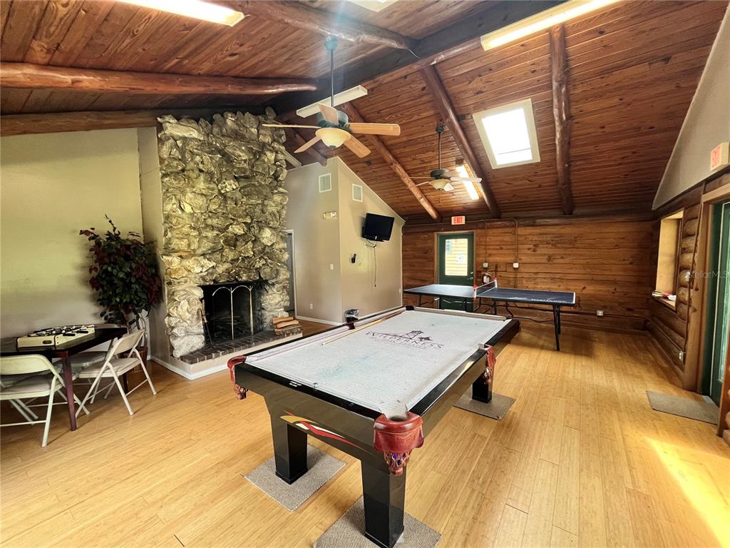 10264 Northeast 28th Loop Silver Springs, FL 34488 - Photo 27 of 44 a view of a patio with table and chairs