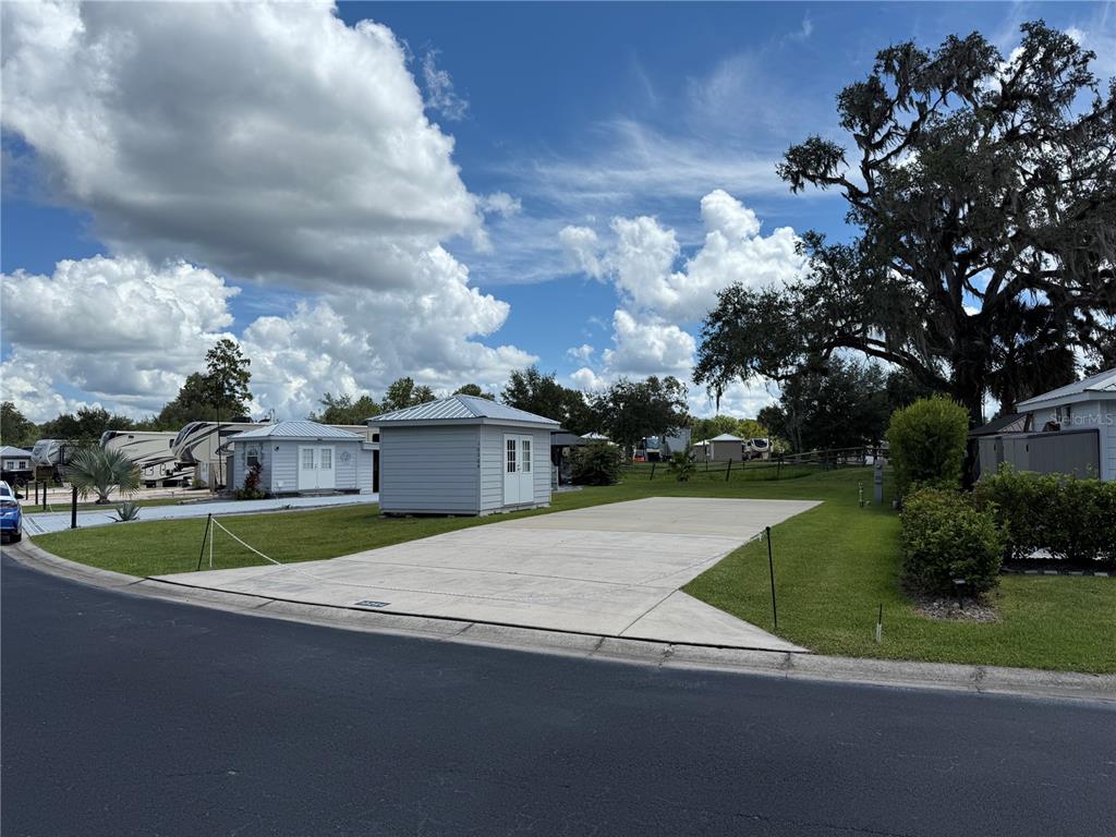 10264 Northeast 28th Loop Silver Springs, FL 34488 - Photo 3 of 44 a view of a house with a big yard and plants