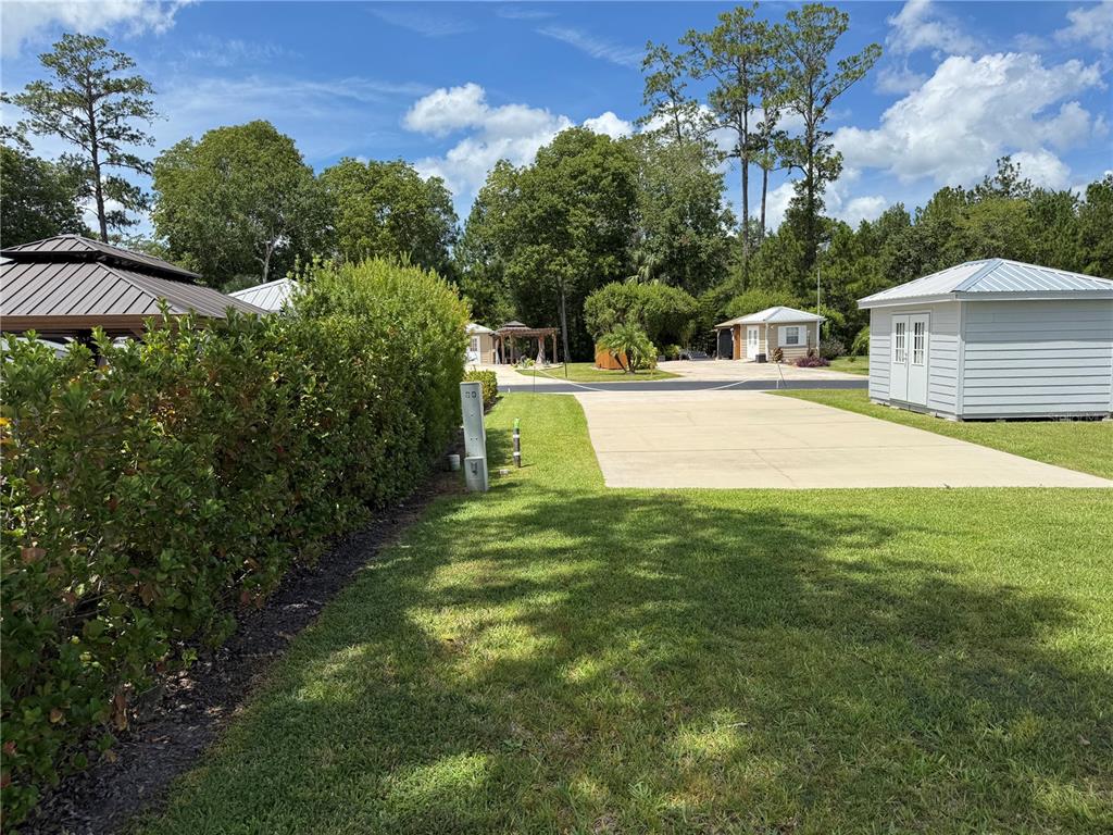 10264 Northeast 28th Loop Silver Springs, FL 34488 - Photo 7 of 44 a view of a house with a yard and basketball court