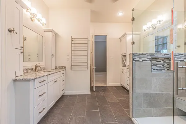 a bathroom with a sink double vanity and a mirror